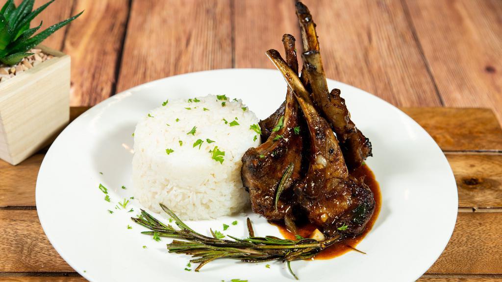 Roasted Rack Of Lamb · Served with your choice of white rice yellow rice rice and beans and steamed cabbage with 2 pieces of complimentary plantains.