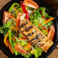 Caesar Salmon Salad · Romaine lettuce tossed with onions and tomato topped with a 6oz piece of salmon with a dash ...