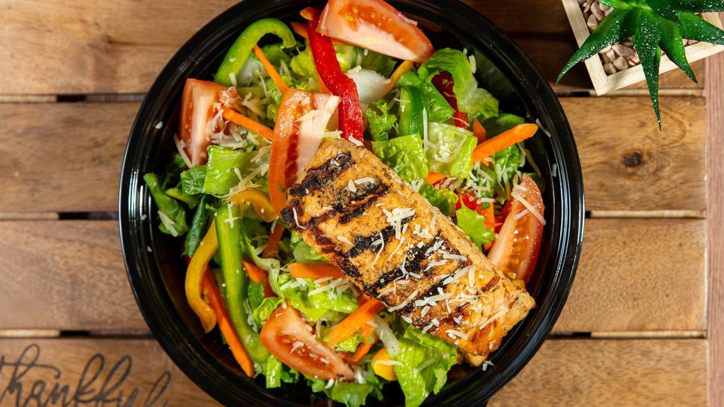 Caesar Salmon Salad · 8oz grilled salmon served on romaine lettuce tossed with onion and tomato sprinkled with parmesan cheese.