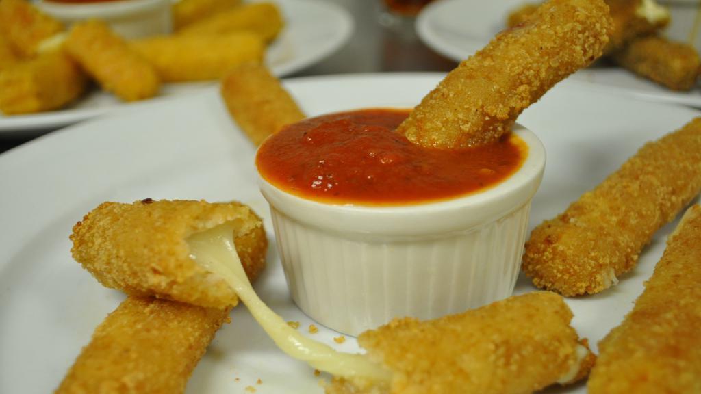 Mozzarella Sticks · Mozzarella in seasoned batter & cooked until crispy. (Side of marinara)
