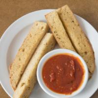 Half Sized Garlic Bread · Toasted organic French bread seasoned with garlic, butter & spices. Make it cheesy bread for...