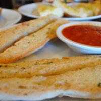 Whole Sized Garlic Bread · Toasted organic French bread seasoned with garlic, butter & spices. Make it cheesy bread for...