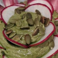 Avocado Ixchel · mayan avocado | roasted ginger | fresh endive leaves | pumpkin seed