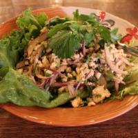 Larb Kai Salad · Minced chicken, ground toasted rice, mint, red and green onion, birds eye chili and fresh li...