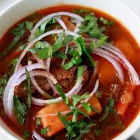 #63. Hu Tieu Bo Kho · Beef stew, beef shank, beef tendon, carrot, basil.