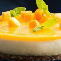 #50. Mango Mousse · Layers of mango mousse and baked pound cake.