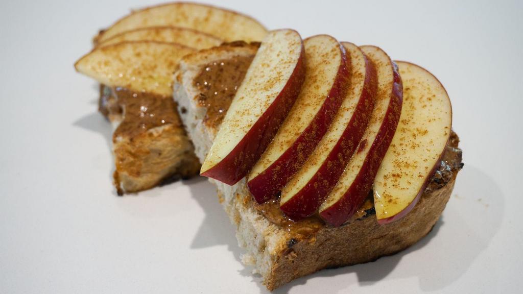 Toast Malone · Local sourdough, almond butter spread, red apples, cinnamon, honey