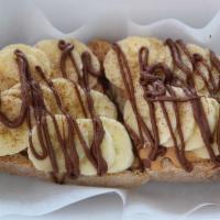 Nutella Peanut Butter Toast · Local sourdough toast with peanut butter, banana, hemp seeds and cinnamon. Drizzled with Nut...