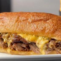 Taphouse Cheesesteak · Roasted Prime Rib, Caramelized Onions, American Cheese, Ciabatta