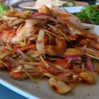 03 Goong Ta Krai (Lemongrass Shrimp) · Spicy. Lemongrass shrimp stir-fried with pepper, bamboo shoot, basil & chili paste.