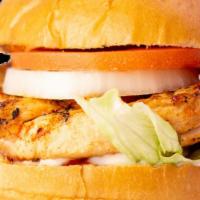 Grilled Chicken Burger · Juicy chicken breast topped with lettuce, tomatoes, onions, ketchup & mayo all served in a s...
