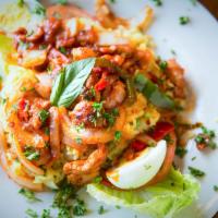 Pollo Salteado El Patio · Sautéed chicken w/ tomato sauce, sliced onions, green and red peppers, and garlic. Served on...