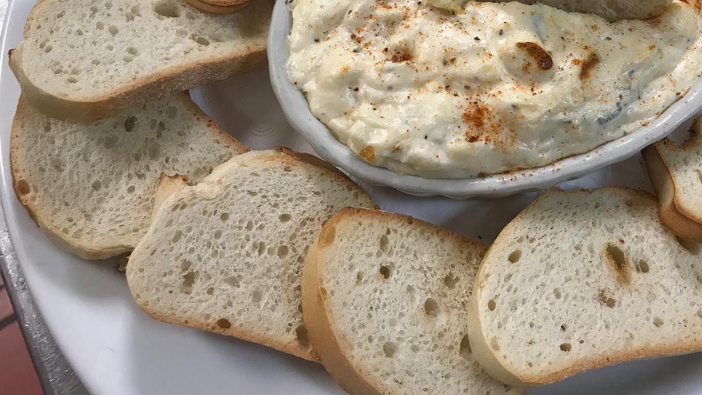 Crab Dip · Deliciously baked and served with toast points.