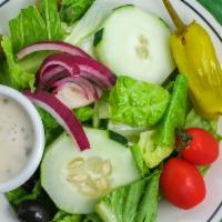 House Salad · Iceberg lettuce and romaine, tomatoes, cucumbers, red onions, olives in a creamy Italian dre...