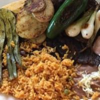 Carne Asada · Servido con arroz, frijoles, papas, cactus, cebollas a la parrilla y jalapeños. / Served wit...
