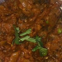 Baigan Bharta · Eggplant cooked with herbs and spices.