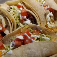 Carnitas Taco · Hard Or Soft Corn Tortilla With Carnitas,  Plus Cheese, Sour Cream, Lettuce, And Tomatoes.