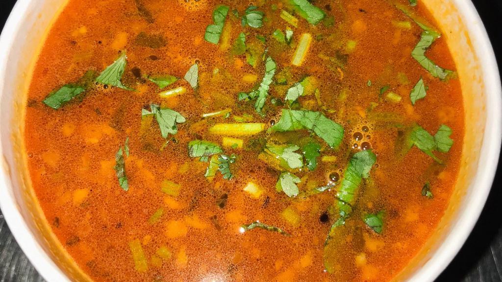 Tomato Dhaniya Shorba · Thin tomato soup flavored with fresh coriander, black pepper and chopped ginger garlic.