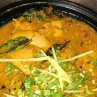 Chicken Chettinad   · Chicken curry made with roasted coconut, curry leaves and a blend of spices. Served with bas...