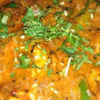 Shrimp Bhuna Kadai · Shrimp cooked in a specially prepared herbs and spices with a touch of ginger and garlic and...