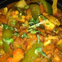 Vegetable Jalfrezi · Vegetarian. Fresh garden vegetables mildly spiced and sprinkled with cheese and nuts. Served...