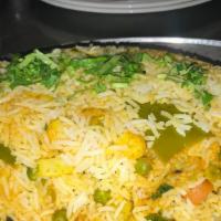 Vegetable Dum Biryani · Basmati rice cooked with mixed vegetables, a blend of herbs and saffron. Served with yogurt ...