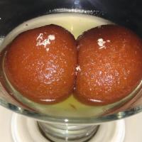 Gulab Jamun · Warm cottage cheese dumplings dipped in sugar syrup and flavored with cardamom. garnished wi...