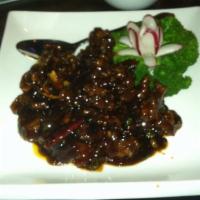 Orange Flavored Beef  · Spicy. An exquisite dish made with thick slices of flank steak lightly fried and sautéed wit...