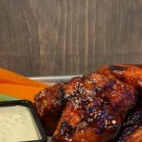 Grilled Bone-In Wings · Marinated for full robust flavor | grilled on open flame. Choice of sauces-buffalo mild | bu...