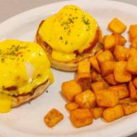 Traditional Benny · canadian bacon on an english muffin with poached eggs and hollandaise