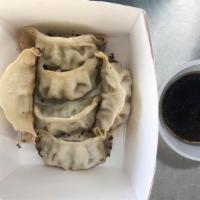 Gyoza · 6 Pork/chicken filled dumplings served with house-made dipping sauce