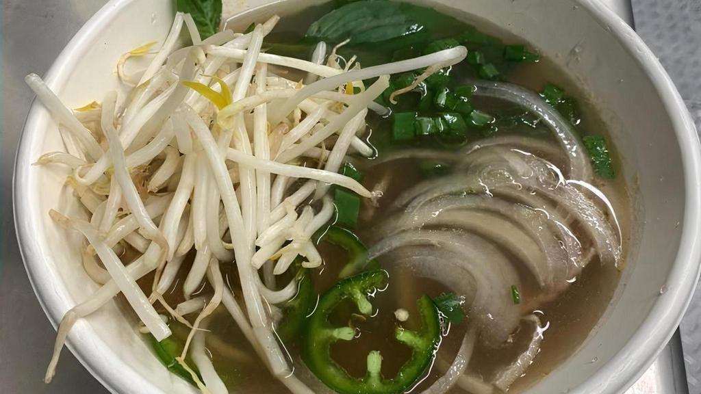 Beef Pho · Traditional Vietnamese Pho beef broth with thinly sliced eye of round, white and green onions & rice noodles. Served with bean sprouts, jalapeños and thai basil.