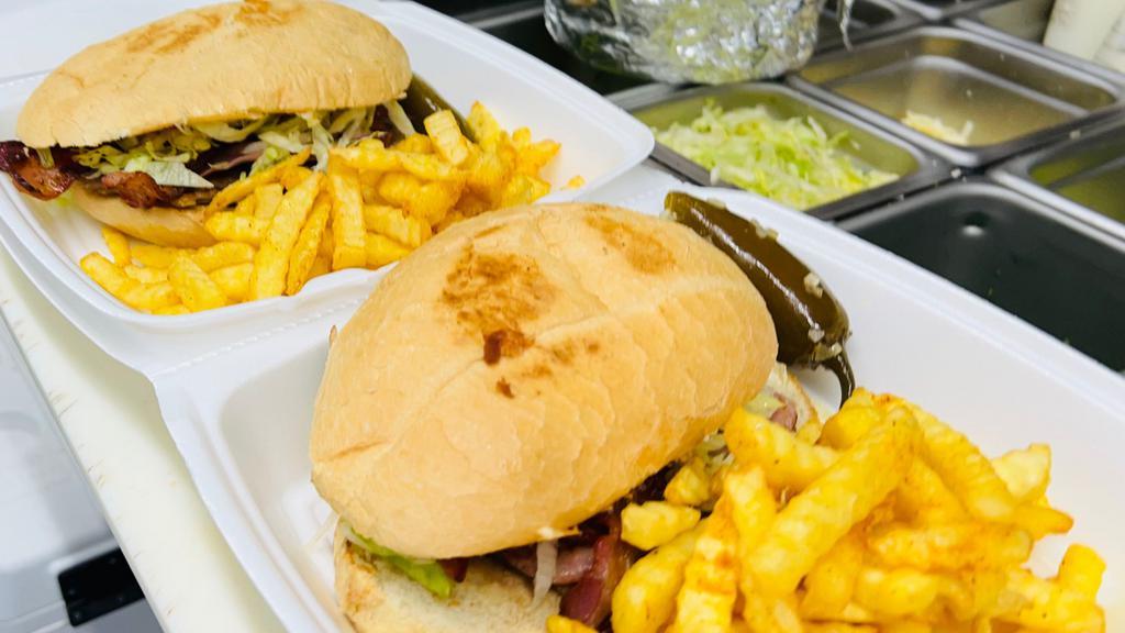 Torta Cubana Combo  · Served with meat choice and , bacon,ham, sausage, lettuce, tomato, onion, avocado, refried beans, cheese and jalapeño  
With fries