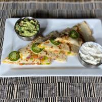 Quesadilla · Choice of chicken or beef. Served w/ sour cream & guacamole