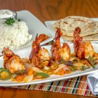 Stuffed Shrimp · Wrapped in bacon. Served on a bed of tomato, onions, and pepper relish, with rice, red beans...