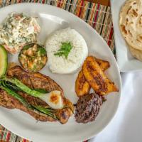 Churrasco · Grilled steak with tomato onion confit. Served with rice, beans, fried potato, Russian salad...