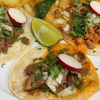 3 Tacos Completos · De la misma carne. Acompañados con arroz y frijoles. / 3 tacos (same meat) served with rice ...