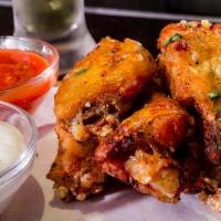 Chicken Wings  6 Ct · Served buffalo style or plain with a choice of ranch or blue cheese.