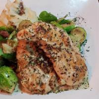 Herb Roasted Chicken · Herb marinated chicken breasts topped with lemon herb butter sauce and served with bacon Bru...