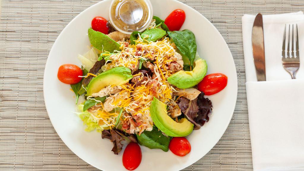 Chicken Avocado Salad · Mixed lettuce, grilled chicken, avocado, warm bacon, tomatoes, topped with colby cheese.