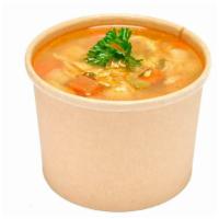 Tuscan Chicken Soup · Spicy Tuscan chicken soup with pasta and hearty vegetables and a piece of our house-made art...