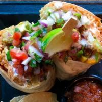 Fajita Burrito · Marinated filet mignon melted cheddar & Jack cheese, grilled peppers, onions, Mexican rice, ...