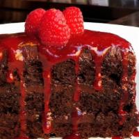 Vegan Chocolate Cake · Three layers of the ultimate vegan
chocolate cake, served with fresh
raspberries & glaze.