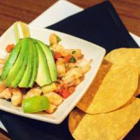 Shrimp Ceviche · Shrimp or fish cooked in fresh lime, tomato, purple onion and cilantro recipe. Served with s...