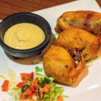 Shrimp Jalapeno Poppers · Three tiger prawn shrimp stuffed with a hint of cheese, wrapped in bacon, grilled jalapeno f...