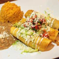 Taquitos  · Your choice of filling wrapped in corn  tortilla and fried until crispy, topped with house b...