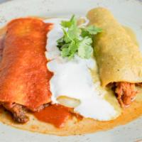 Mexican Flag · Corn tortilla, beef barbacoa, chicken tinga, Mexican cheeses, tomatillo, and chipotle sauce.