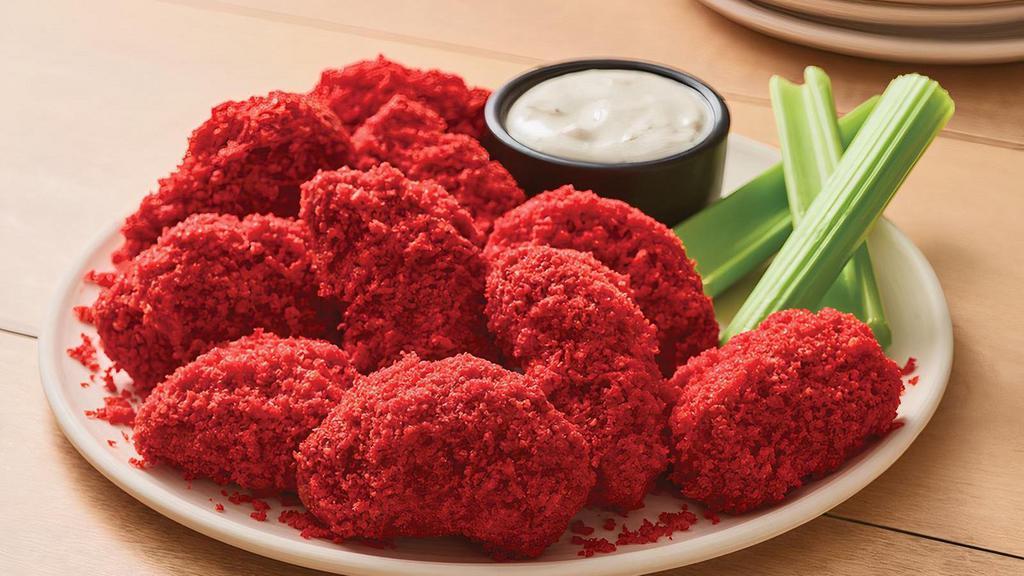 Boneless Wings - Cheetos® Flamin’ Hot® · Turn up the heat with Cheetos® Flamin’ Hot® flavor that hits the spot! Tossed in sauce and coated in crunchy Cheetos® Flamin’ Hot® crumbles. Served with celery and house-made ranch or Bleu cheese dipping sauce.