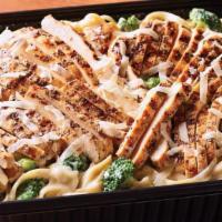 Classic Broccoli Chicken Alfredo - Serves 6-8 · Juicy grilled chicken is served warm on a bed of fettuccine pasta tossed with broccoli and r...