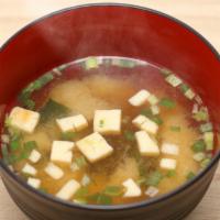 Miso Soup · Japanese soup with seaweed, tofu and scallions.